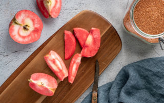 Lucy™ apples on a cutting board