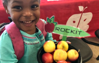 Girl holding Rockit™ apples